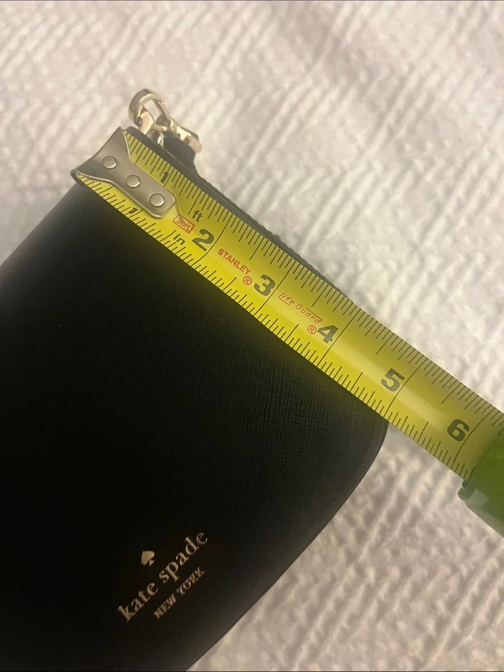 Kate Spade black crossbody saddlebag with gold logo